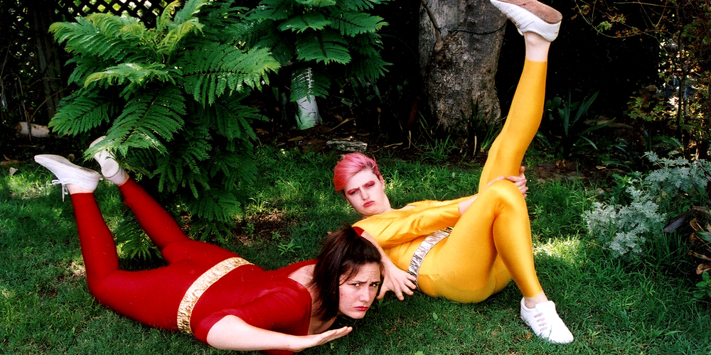 dancers lying on grass